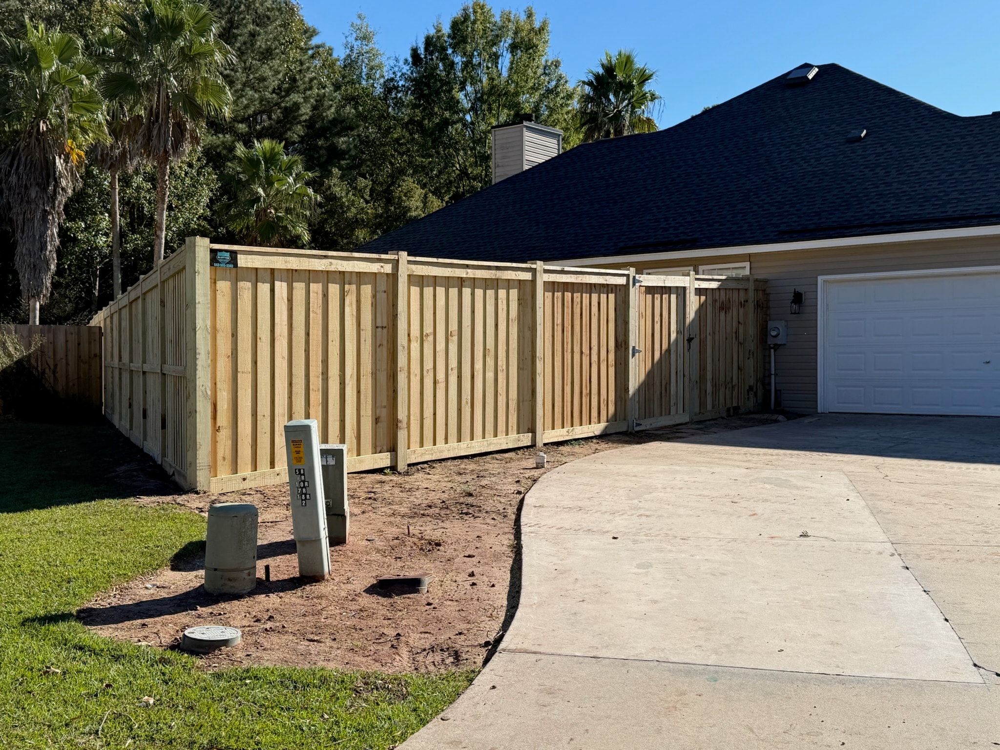Wood fence with gate installation
