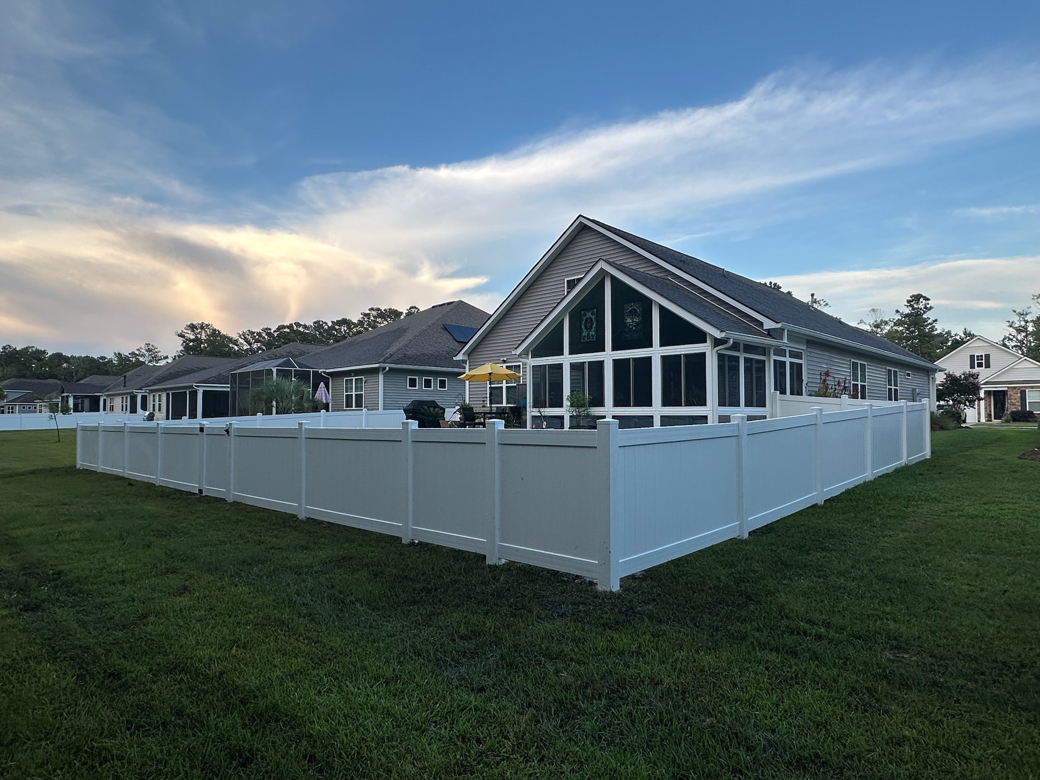 White vinyl fence backyard